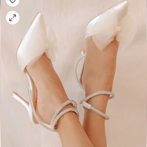 Lulus white bow heels size 8. Never worn.